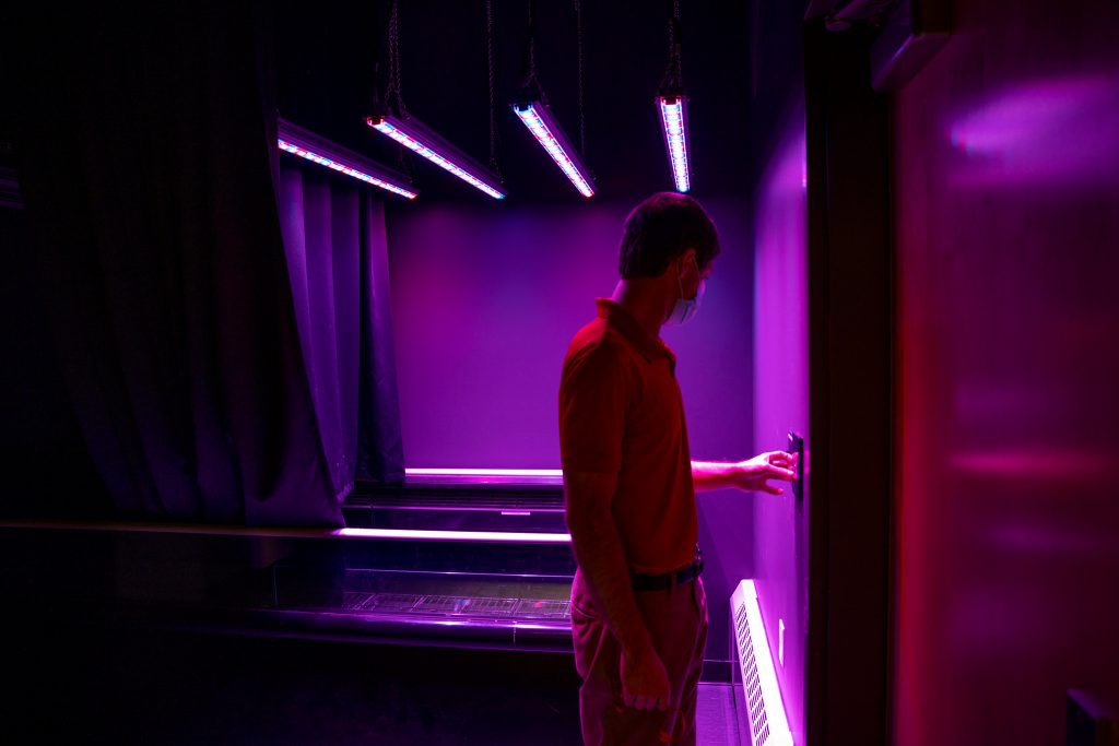 Dillon Walker uses a wall mounted control to adjust the lights in the Sensory Lab at MSABD.