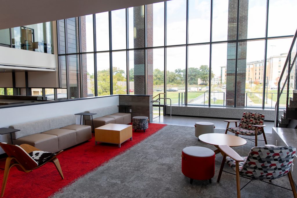 The MSABD mezzanine features bench seating along with several chairs and tables in a bright open space.