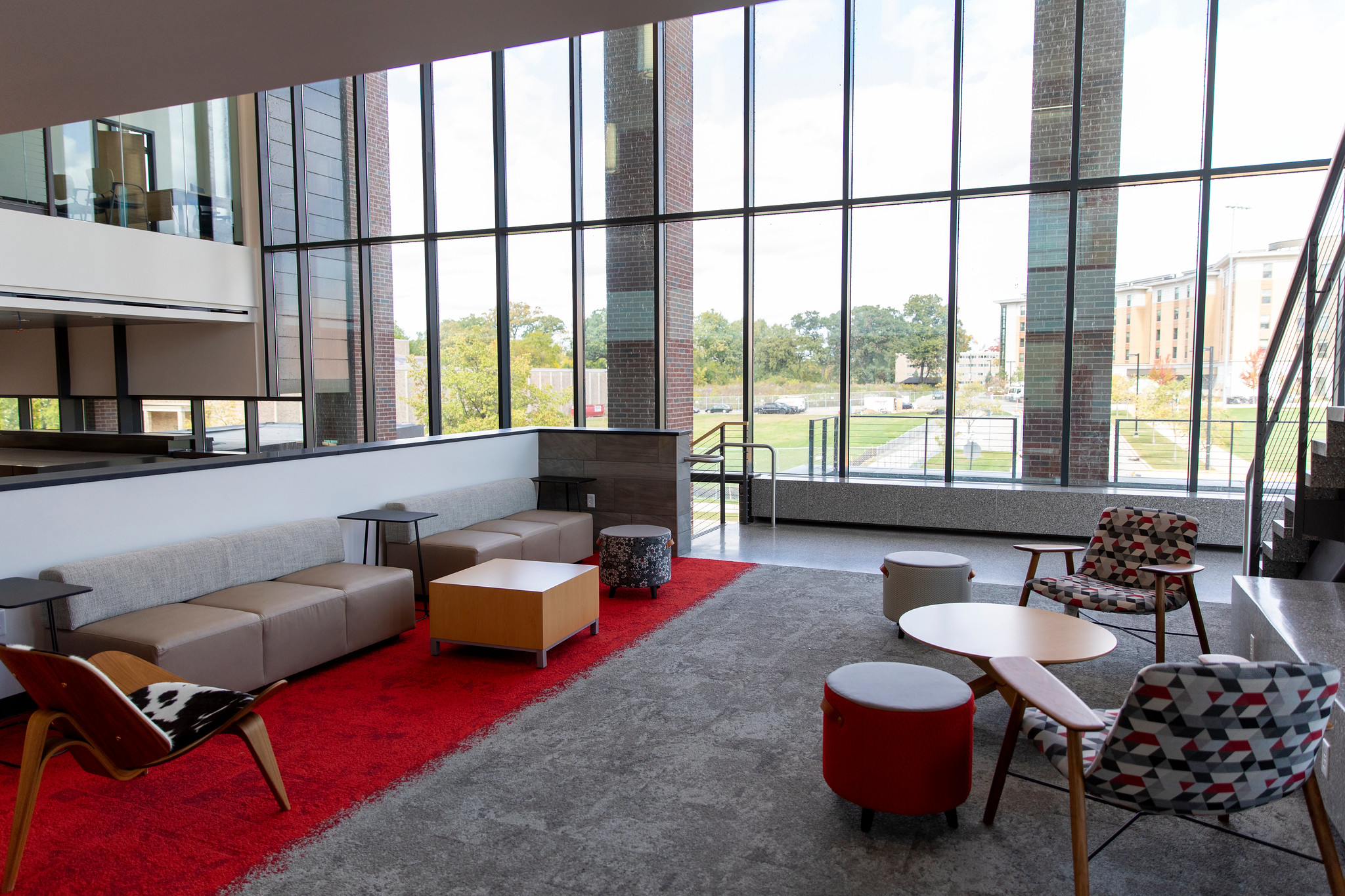 The MSABD mezzanine features bench seating along with several chairs and tables in a bright open space.