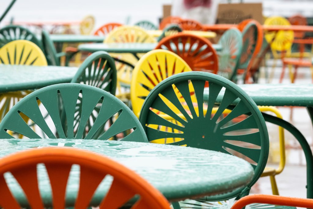 Colorful sunburst chairs sit on the Memorial Union Terrace.