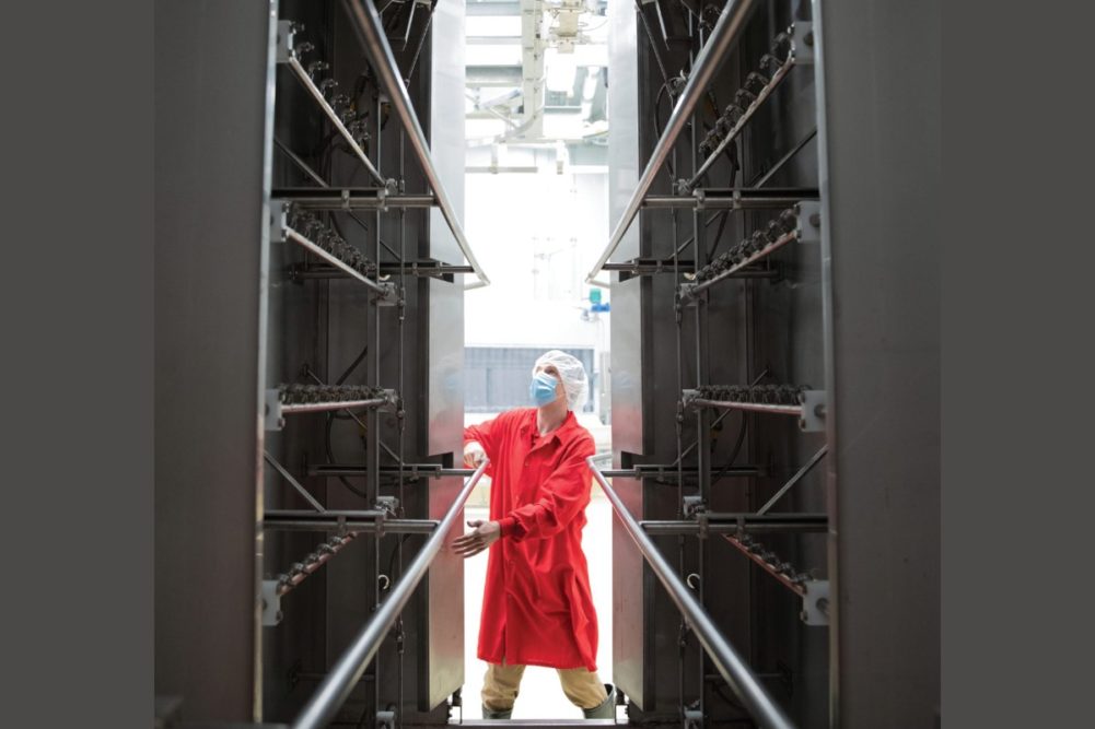 Dillon Walker, meat plant operations manager, adjusts doors to a carcass spray washer on the harvest floor at Meat Science and Animal Biologics Discovery Building at UW-Madison.